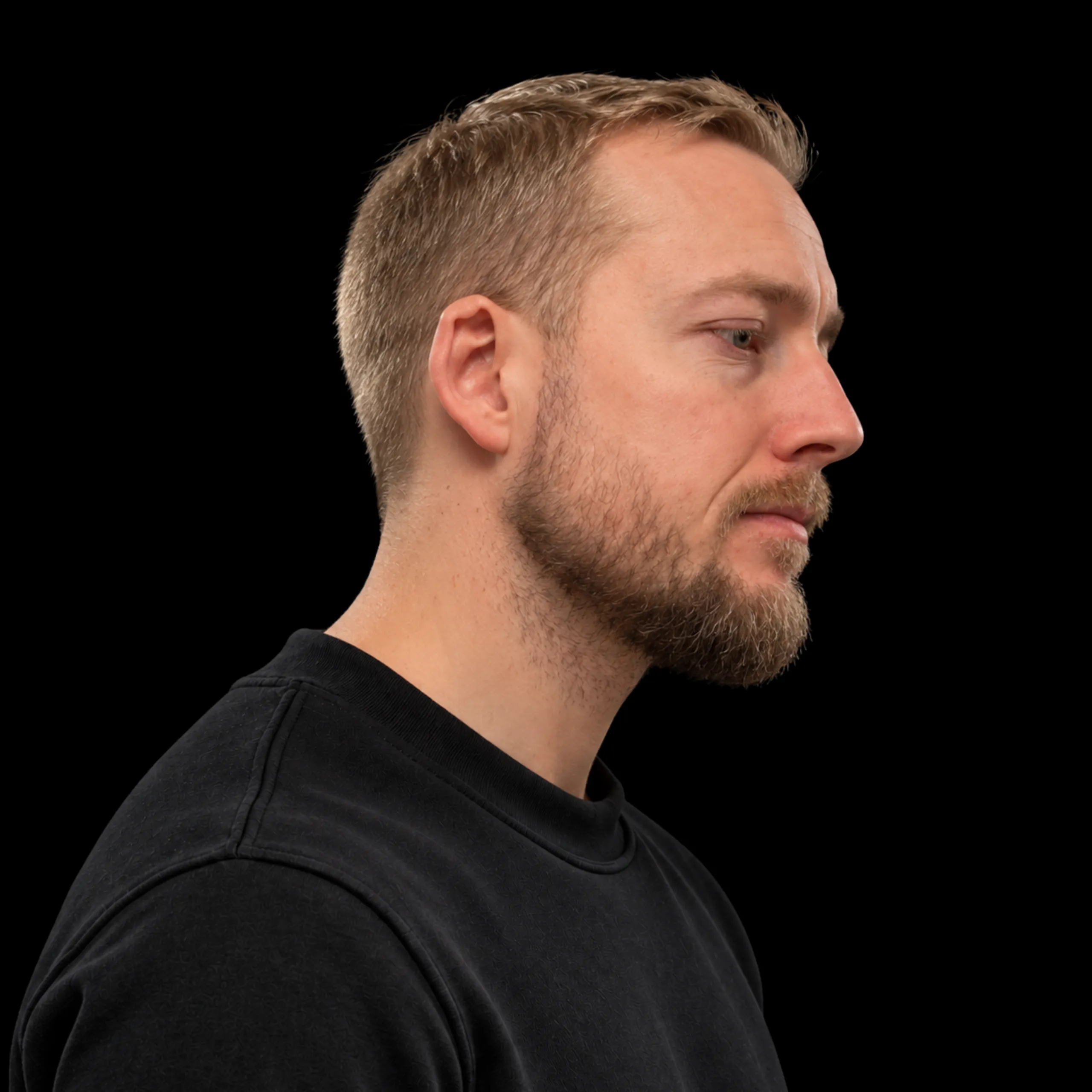 Christian Katzmann in profile, on black