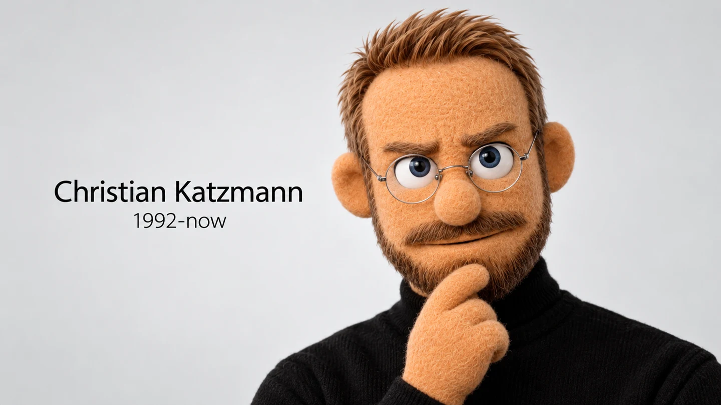 Christian's puppet in a black turtleneck, hand on chin